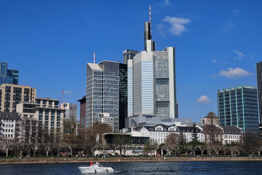 Frankfurt skyline with modern skyscrapers along the Main River, featuring iconic architecture.