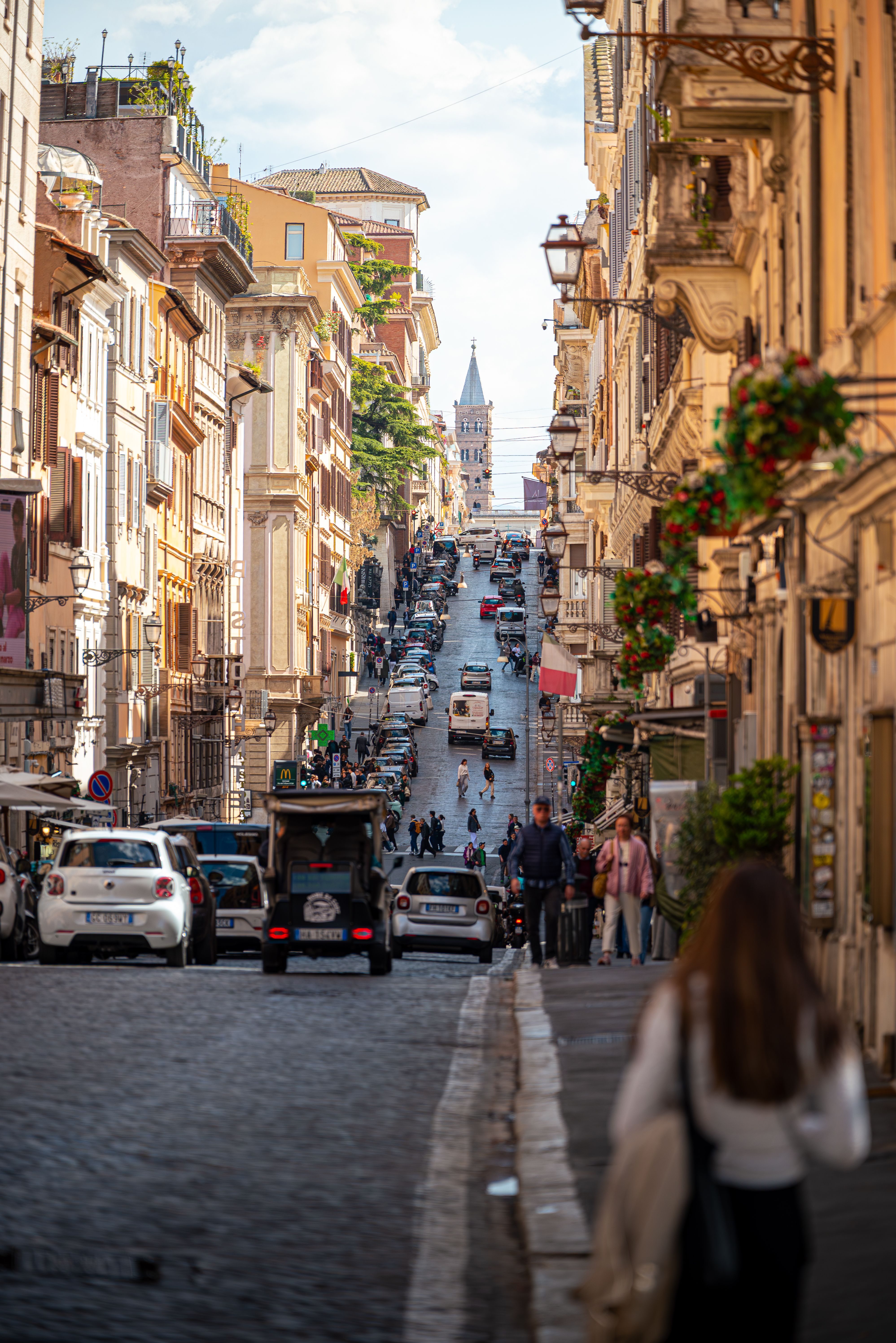Bustling Urban Street in Rome with Cars and Pedestrians · Free Stock Photo