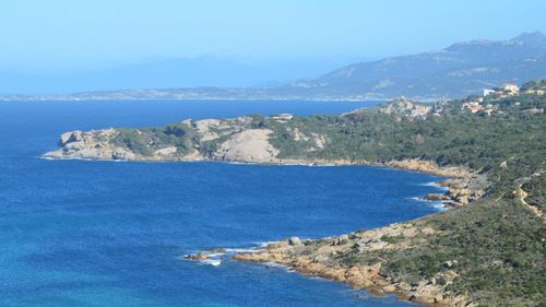 Free Beautiful coastal landscape of Calvi in Corsica, France with clear blue sea and rocky shoreline. Stock Photo