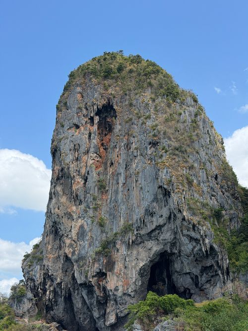 Free Stunning limestone cliff under a clear blue sky in Krabi, Thailand. Stock Photo