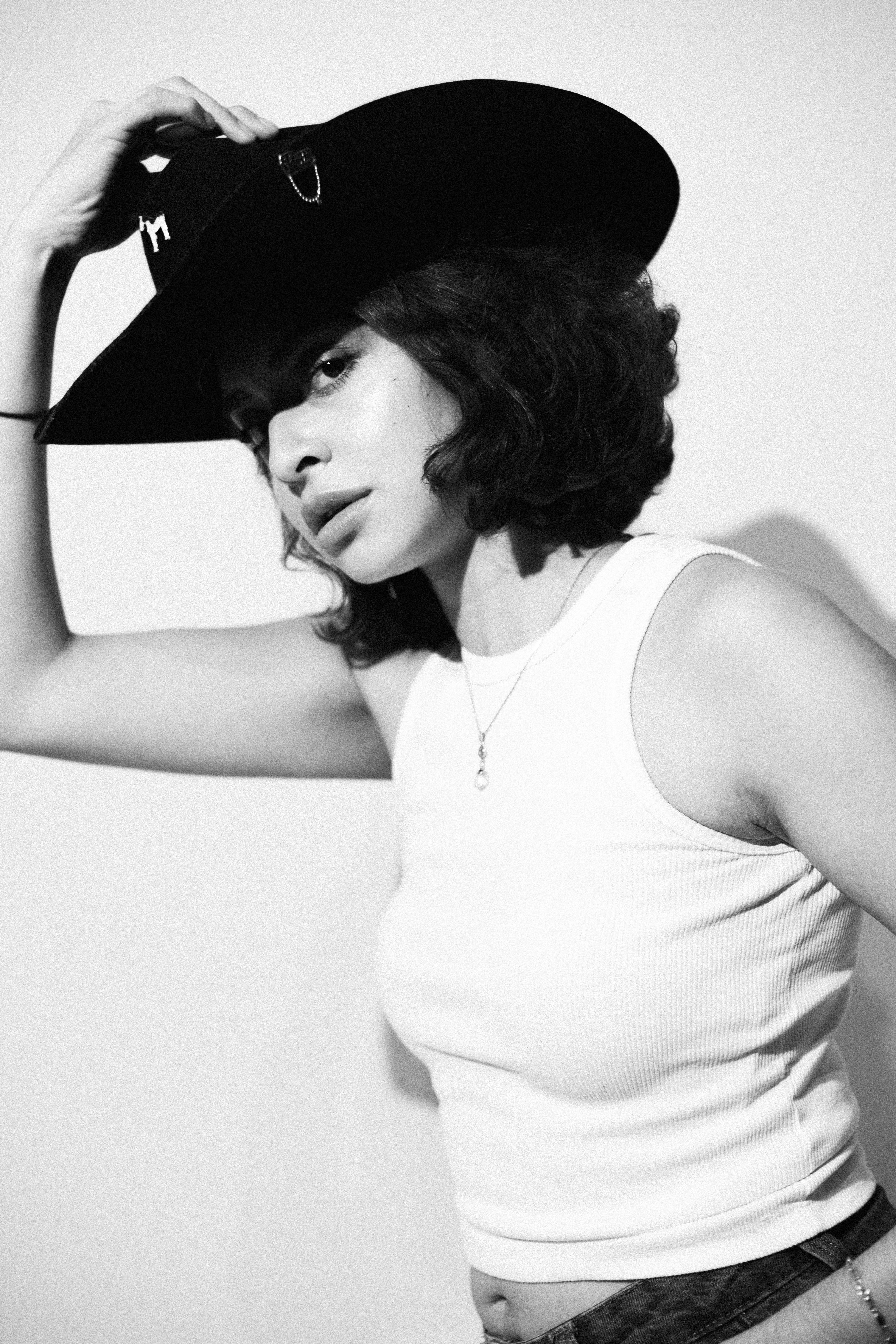 Black and White Portrait of Young Woman in Cowboy Hat · Free Stock Photo