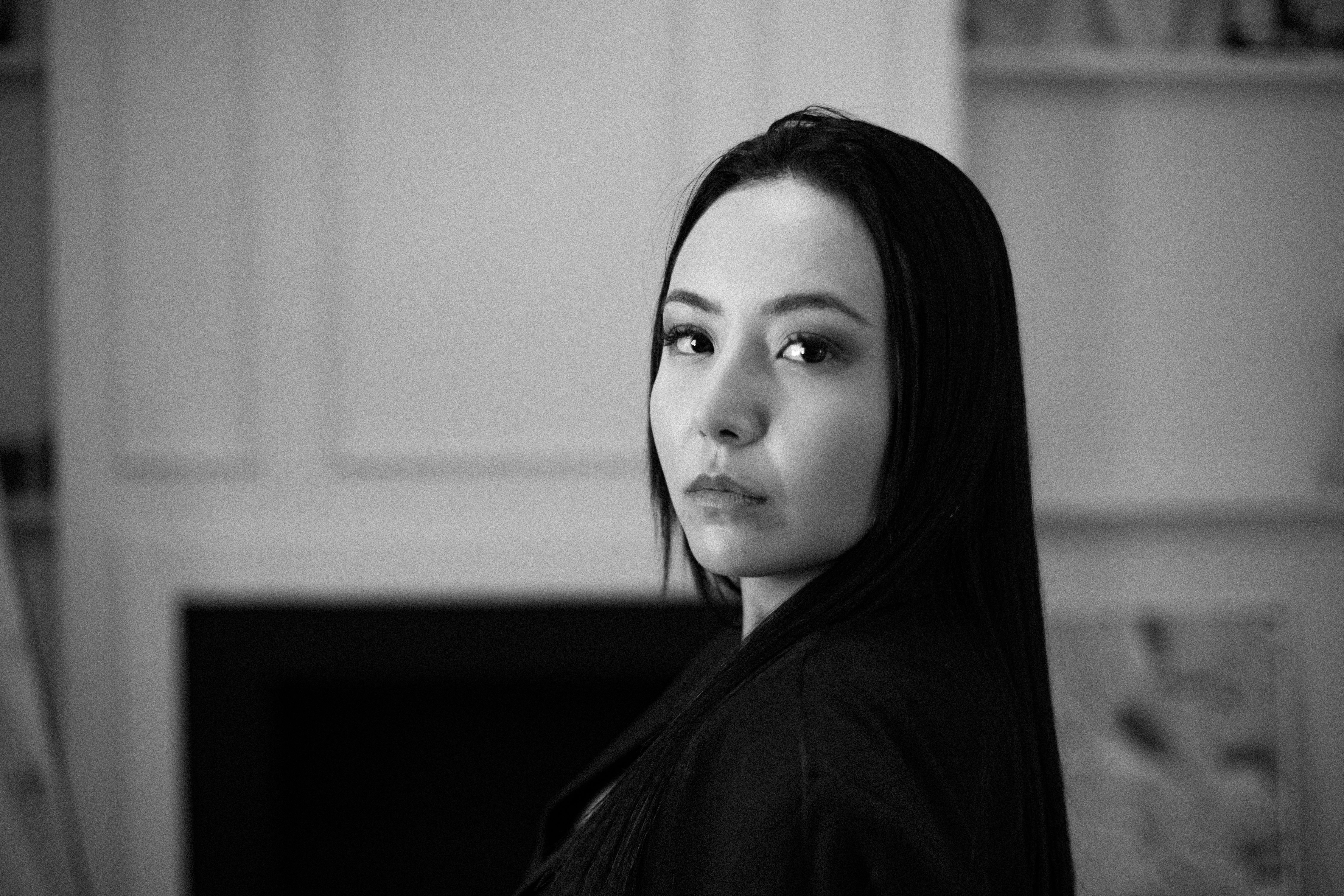 Black and White Portrait of a Woman Indoors · Free Stock Photo