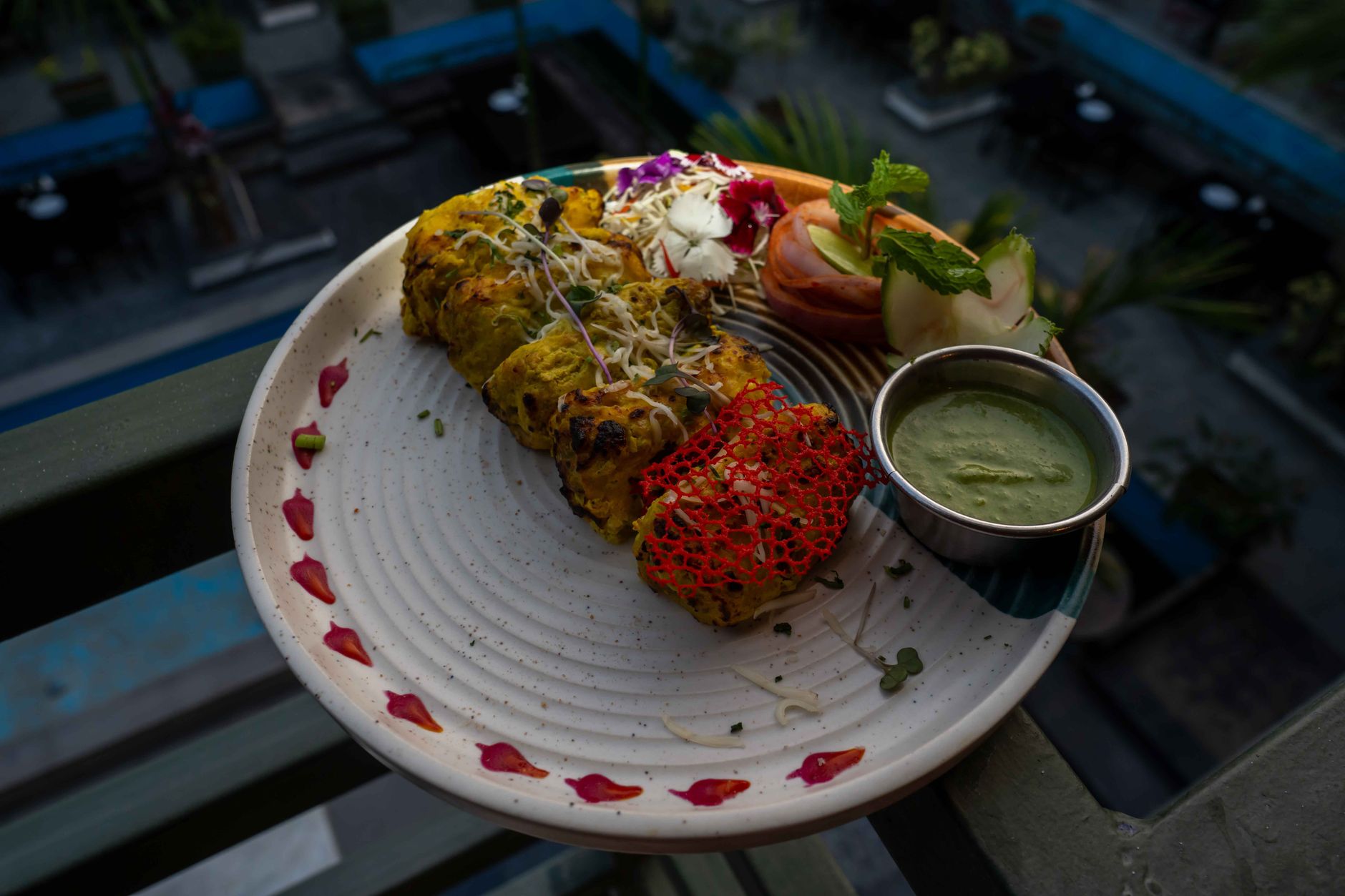 Close-up of golden tandoori grilled vegetables on a plate