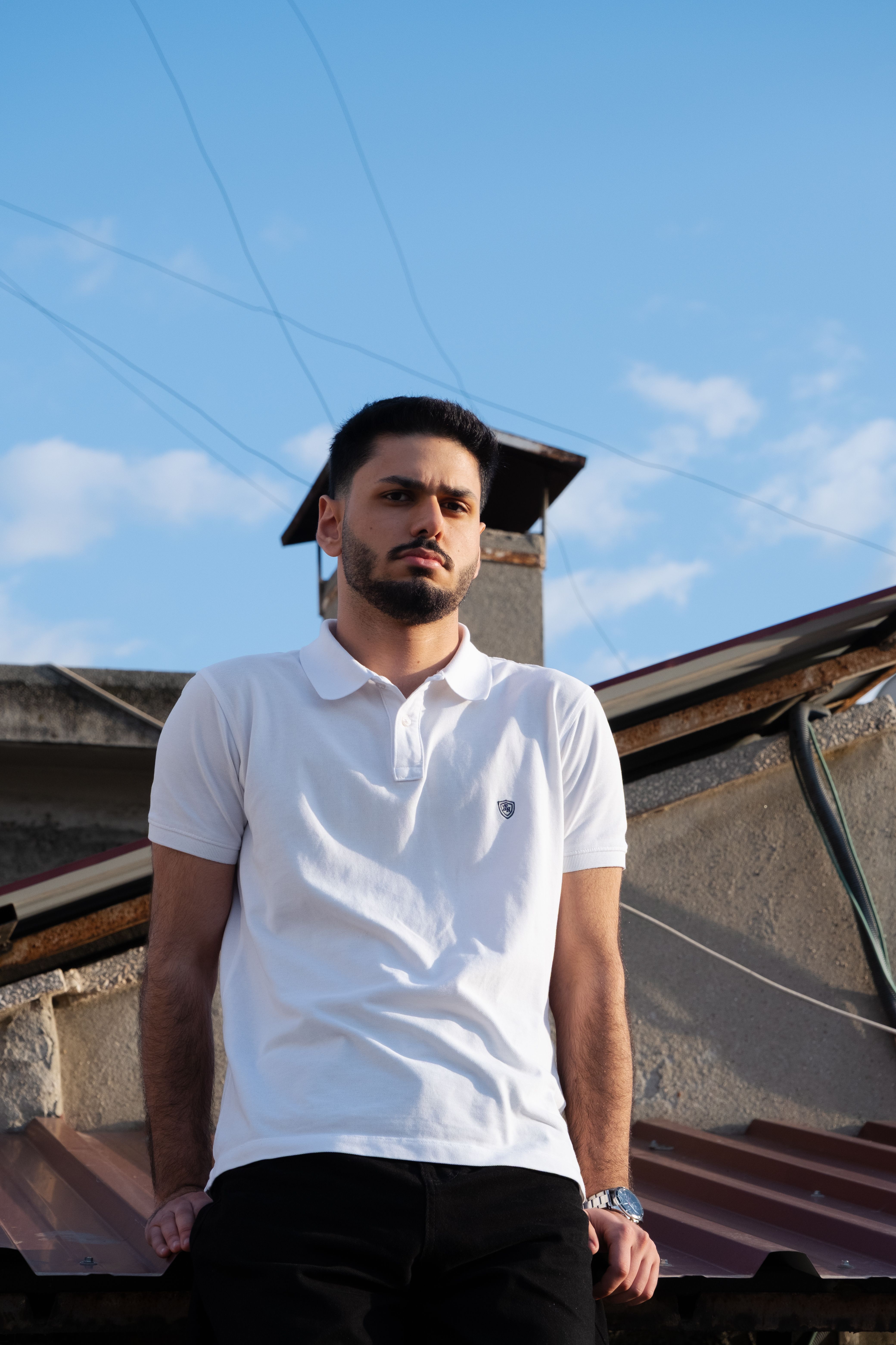 Confident Young White Polo Shirt Leaning