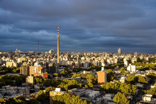 Free Aerial view of Montevideo, Uruguay showcasing urban architecture and green spaces under a dramatic sky. Stock Photo