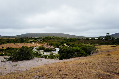 Free Vast rural landscape featuring rolling hills under a cloudy sky, ideal for travel and nature themes. Stock Photo