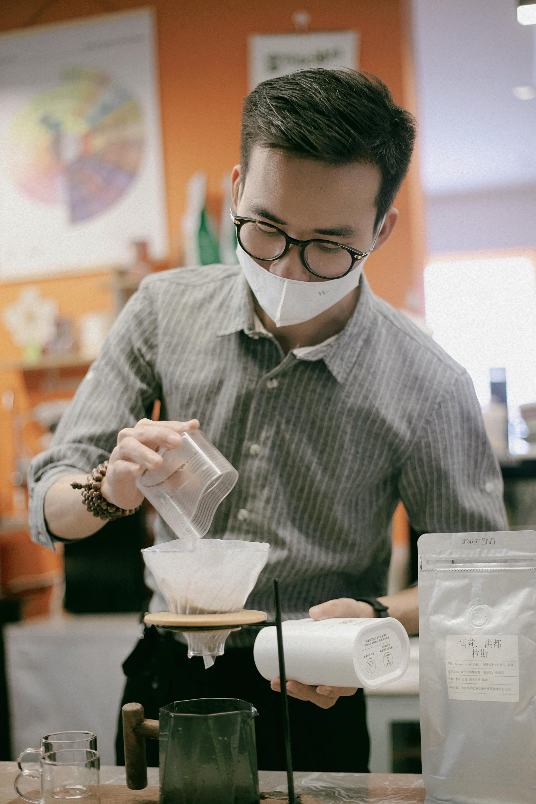 Minimalist interior of a specialty coffee roastery cafe in Singapore with pour-over equipment