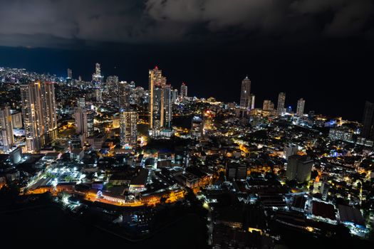 Captivating aerial view of Colombo's illuminated skyline at night, showcasing urban beauty and city lights.