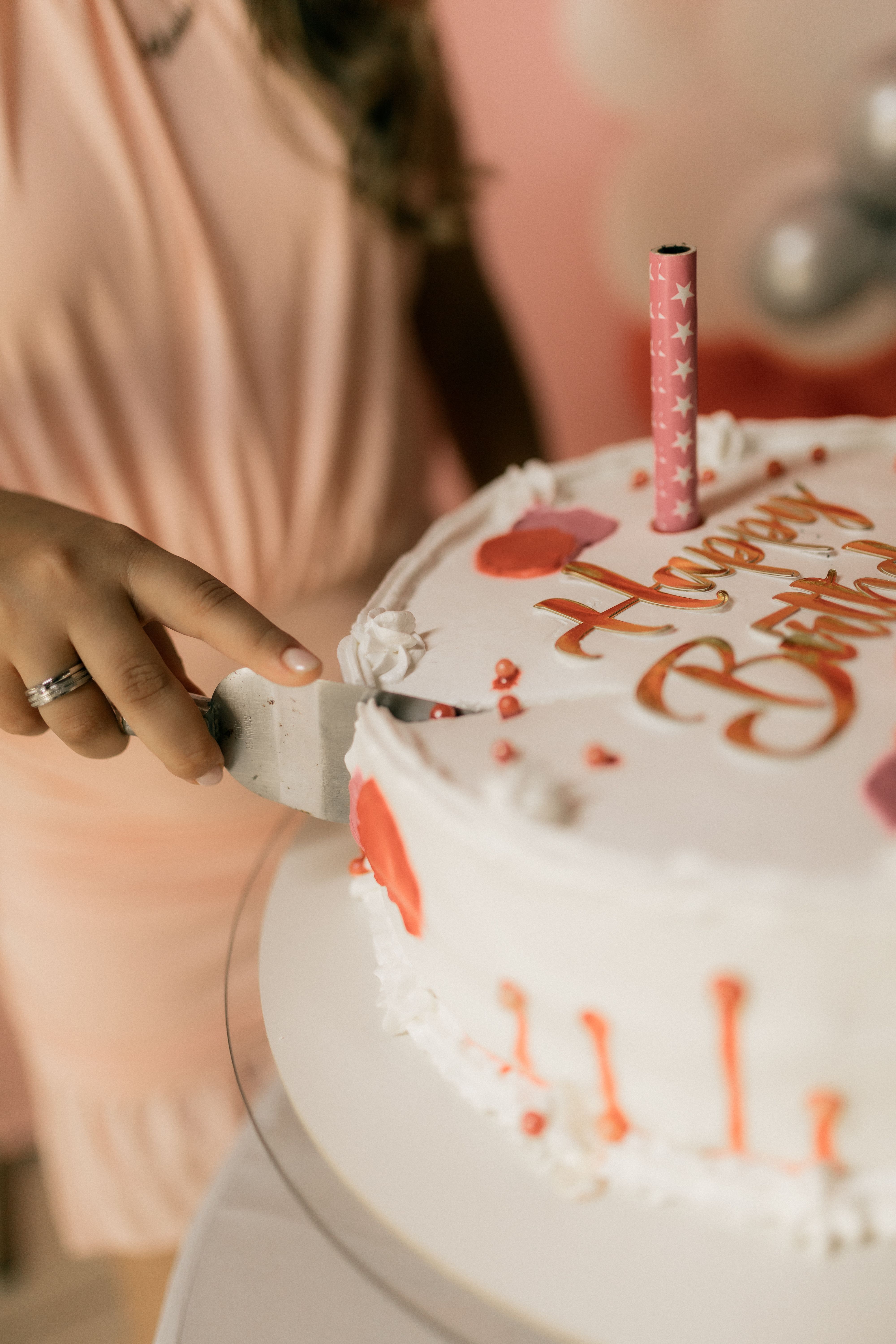 Close-up of birthday cake with candles and festive decorations