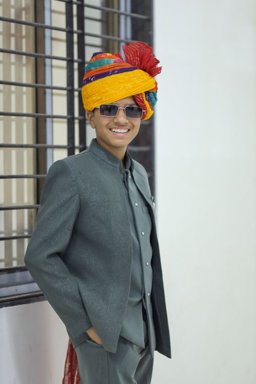 Free A young man in traditional Indian attire and turban posing confidently indoors. Stock Photo