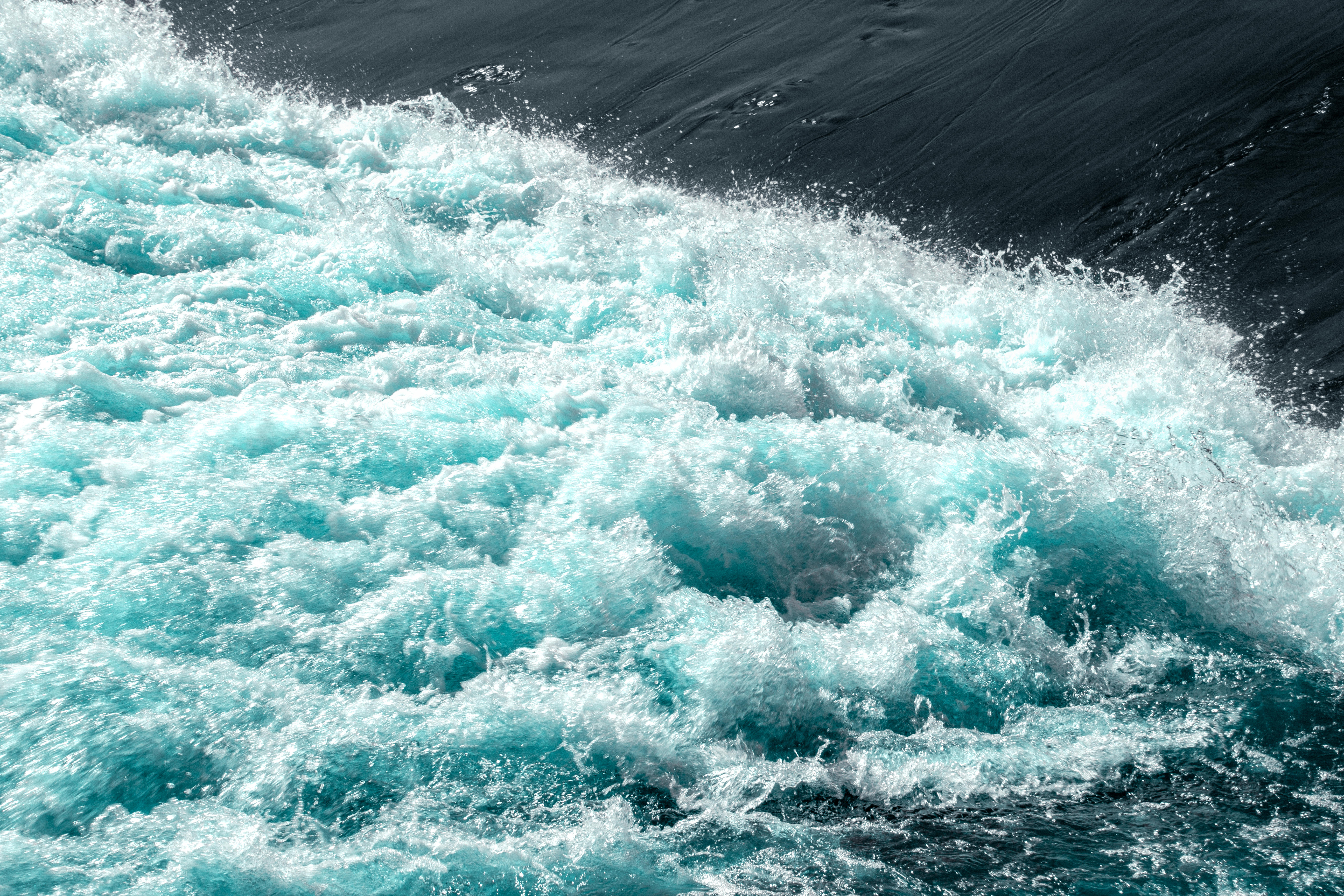 Dynamic image of vibrant blue water rapids in Shrewsbury, capturing nature's energy.