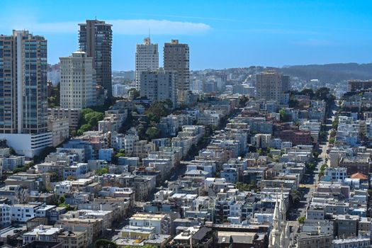 Aerial view of San Francisco's urban landscape showcasing high-rise buildings and residential areas.