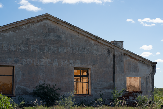 Photograph of an abandoned building in Córdoba, Argentina, showcasing rustic decay.