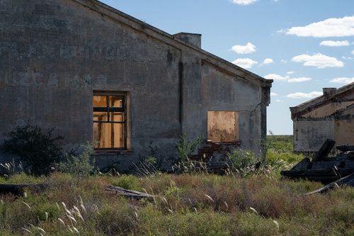 Free Desolate ghost village captured in rural Córdoba, showcasing old architecture and nature reclaiming its space. Stock Photo