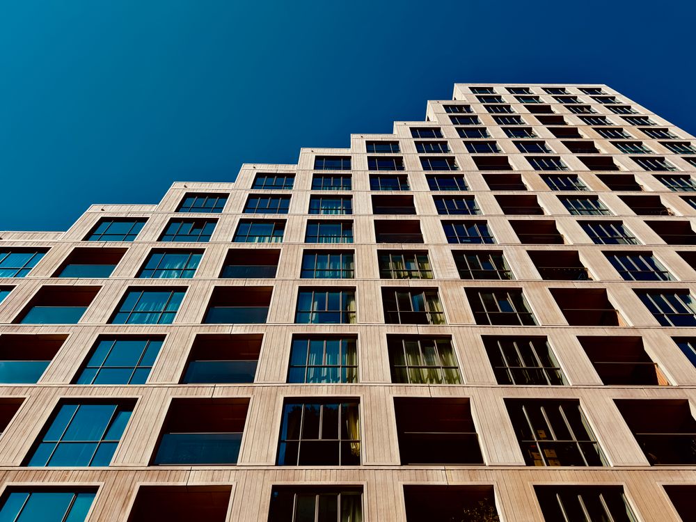 Modern high-rise building against a clear blue sky