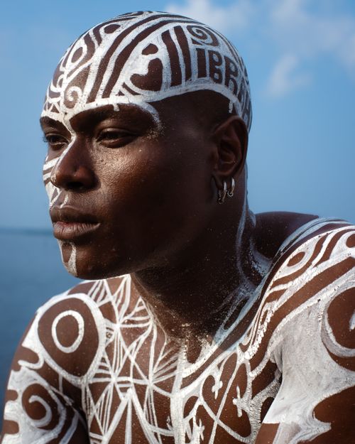 Free Striking portrait of a man with captivating traditional African body art and patterns. Stock Photo