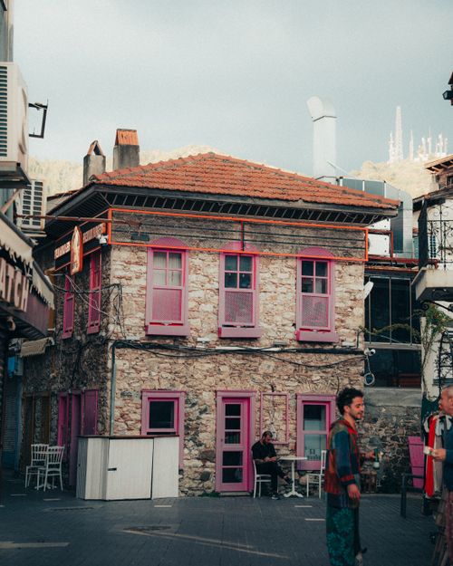 Free Colorful stone building with pink accents in vibrant Marmaris street scene. Stock Photo