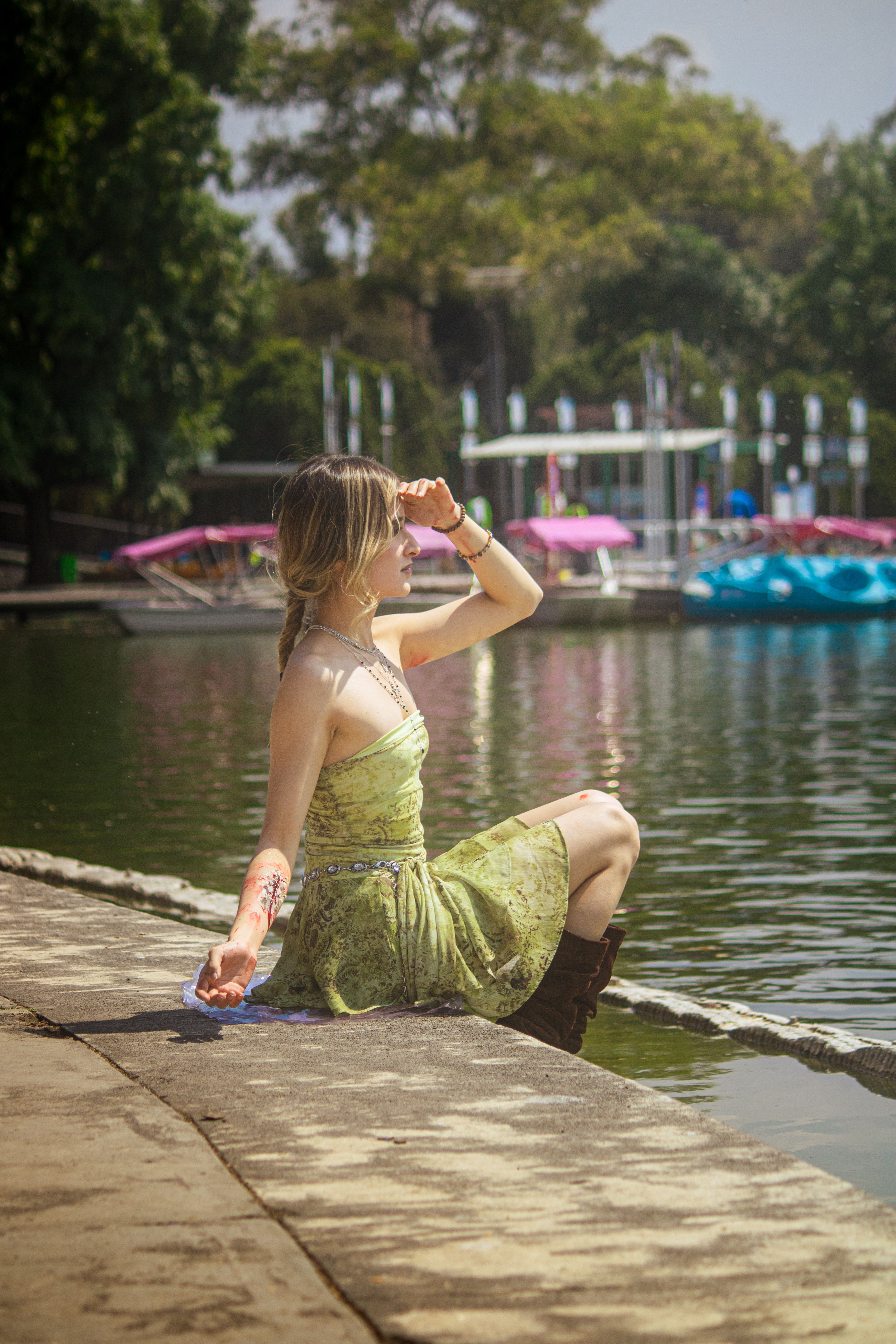 Beautiful Model in Green Dress Posing on Boat on Lake  Free Stock Photo