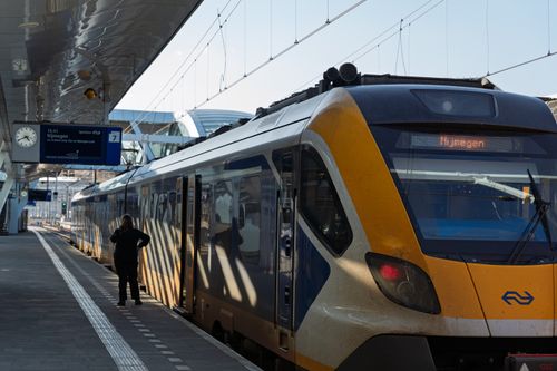 Free Modern train at a station platform heading to Nijmegen, showcasing Dutch rail transit. Stock Photo