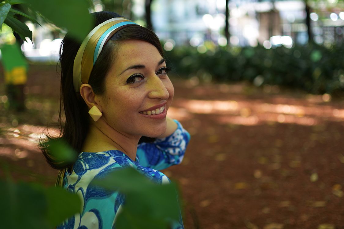 Smiling Woman in Colorful Outfit Outdoors · Free Stock Photo