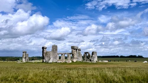Free Stunning view of Stonehenge against a backdrop of clouds and blue sky. Stock Photo