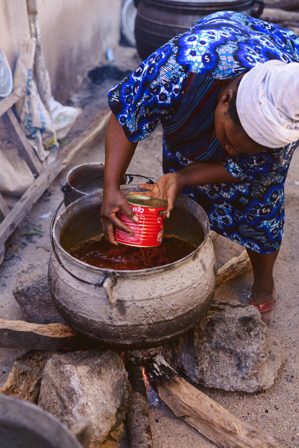 Traditional outdoor cooking methods used to prepare classic Ghanaian dishes