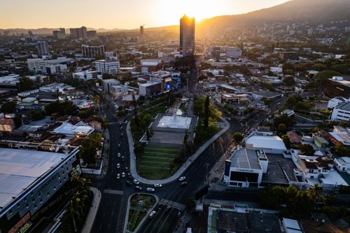 Free Stunning aerial view of San Salvador cityscape during sunset, showcasing urban landscape and vibrant colors. Stock Photo