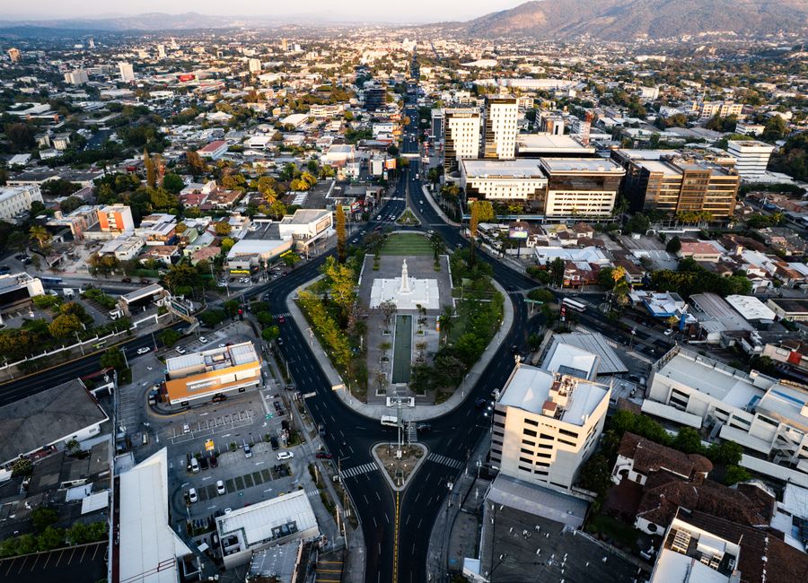 Stunning aerial shot of San Salvador's cityscape centering on the iconic Monumento al Divino Salvador del Mundo.