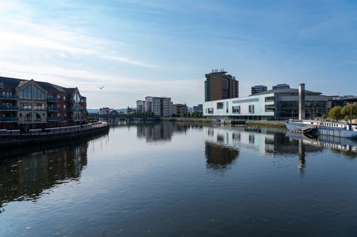 Free Peaceful riverside view of modern and classic architecture in Dublin, Ireland. Stock Photo