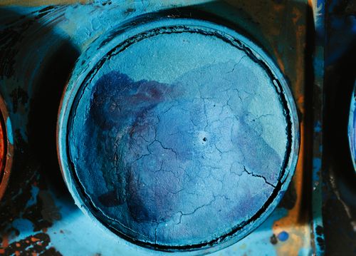 Free Detailed view of a cracked blue paint coating on a metal surface, showing texture and color variation. Stock Photo