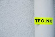 Yellow Sticker Labeled on White Rolled Surface