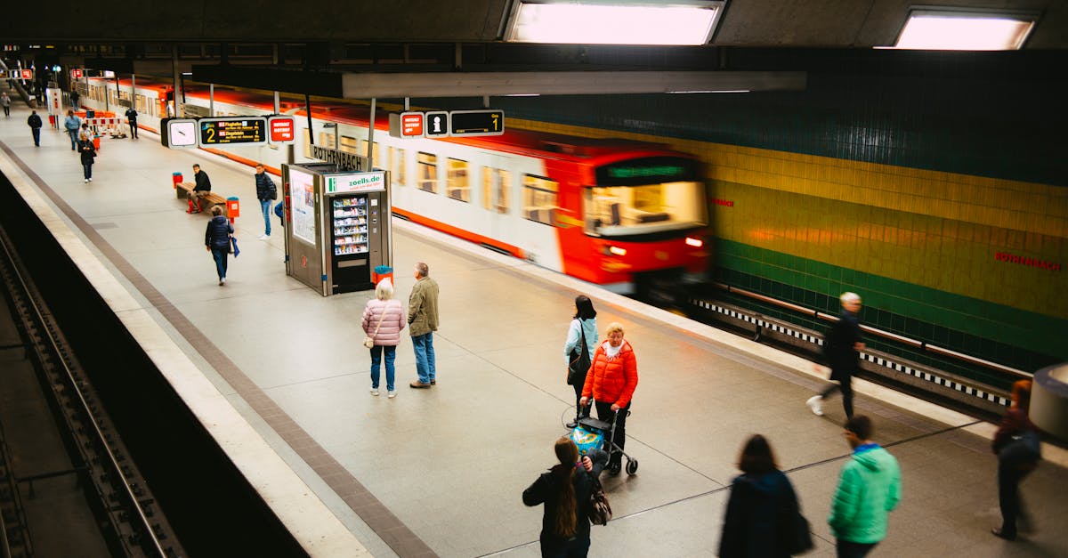 Photo by Markus Spiske Vibrant subway station scene with people and a fast-moving train on the platform.