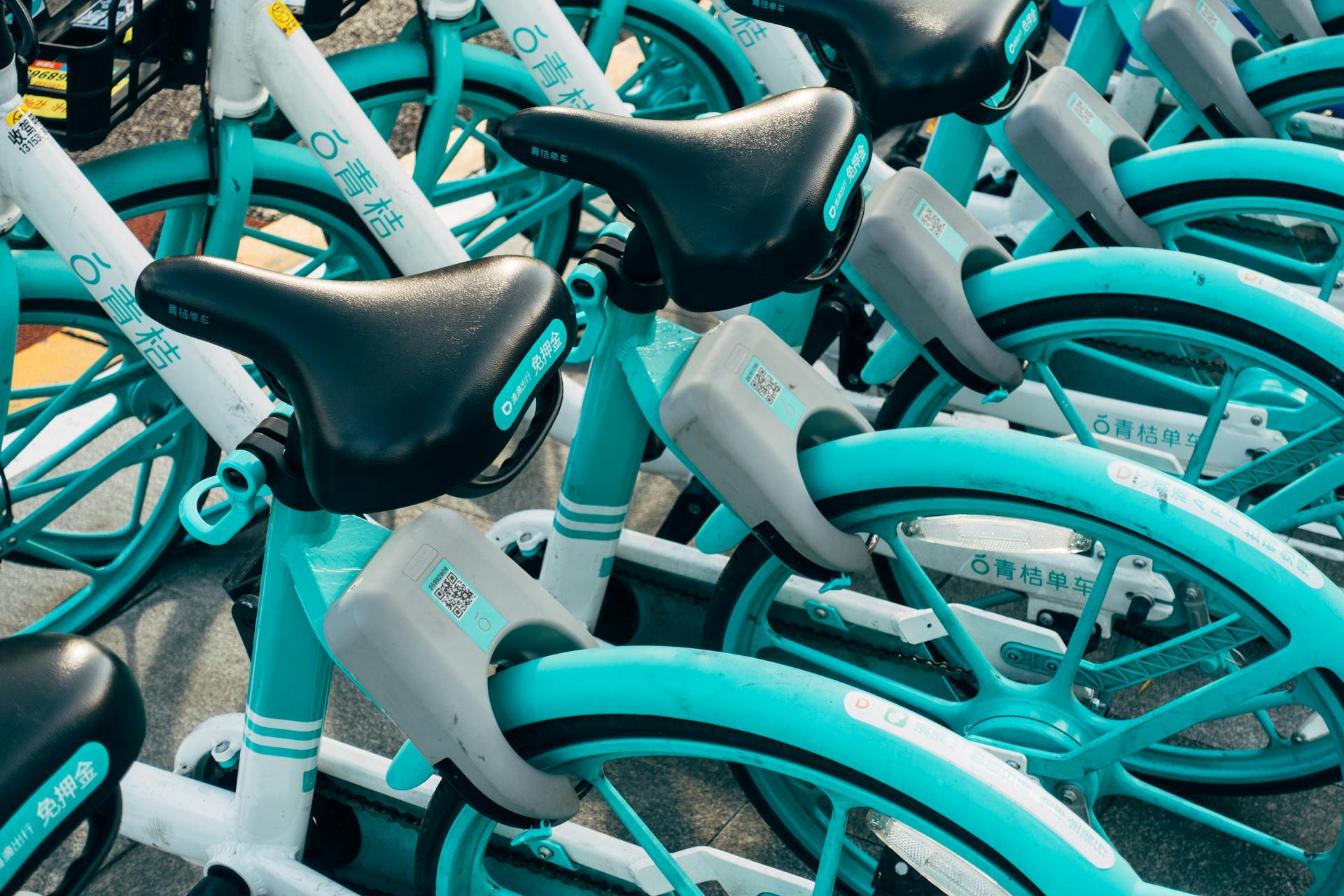 Colorful rental bicycles parked outdoors in Beijing, China.