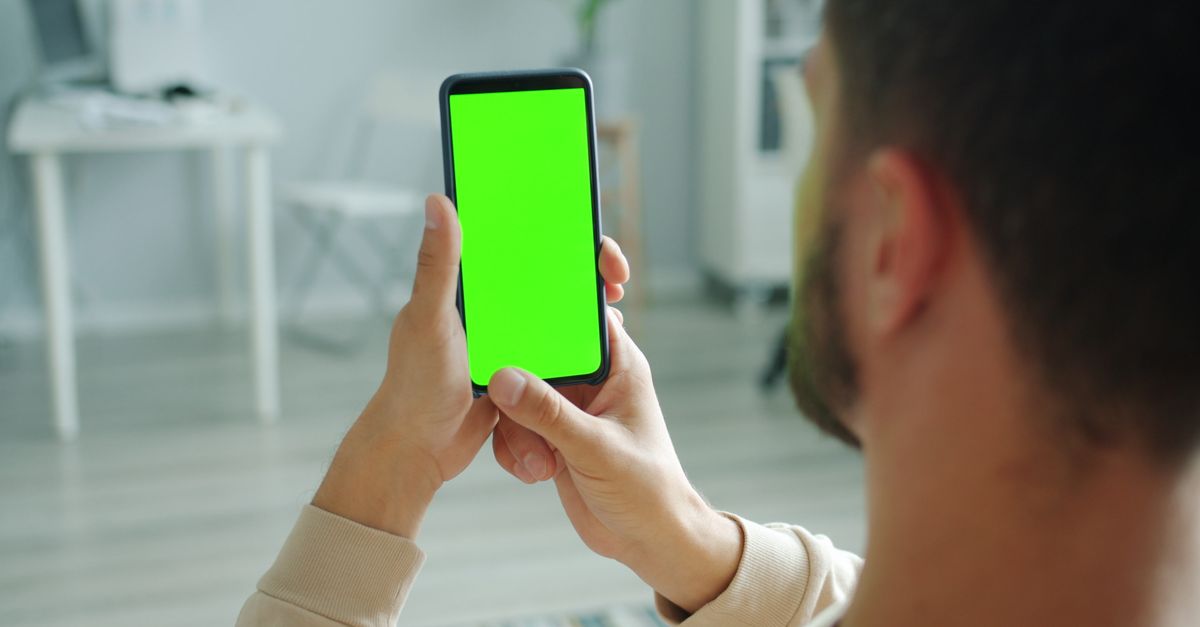 person checking weather app on smartphone in rain