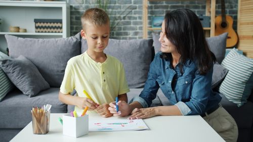 Free A mother and child enjoy creative drawing time indoors. Stock Photo