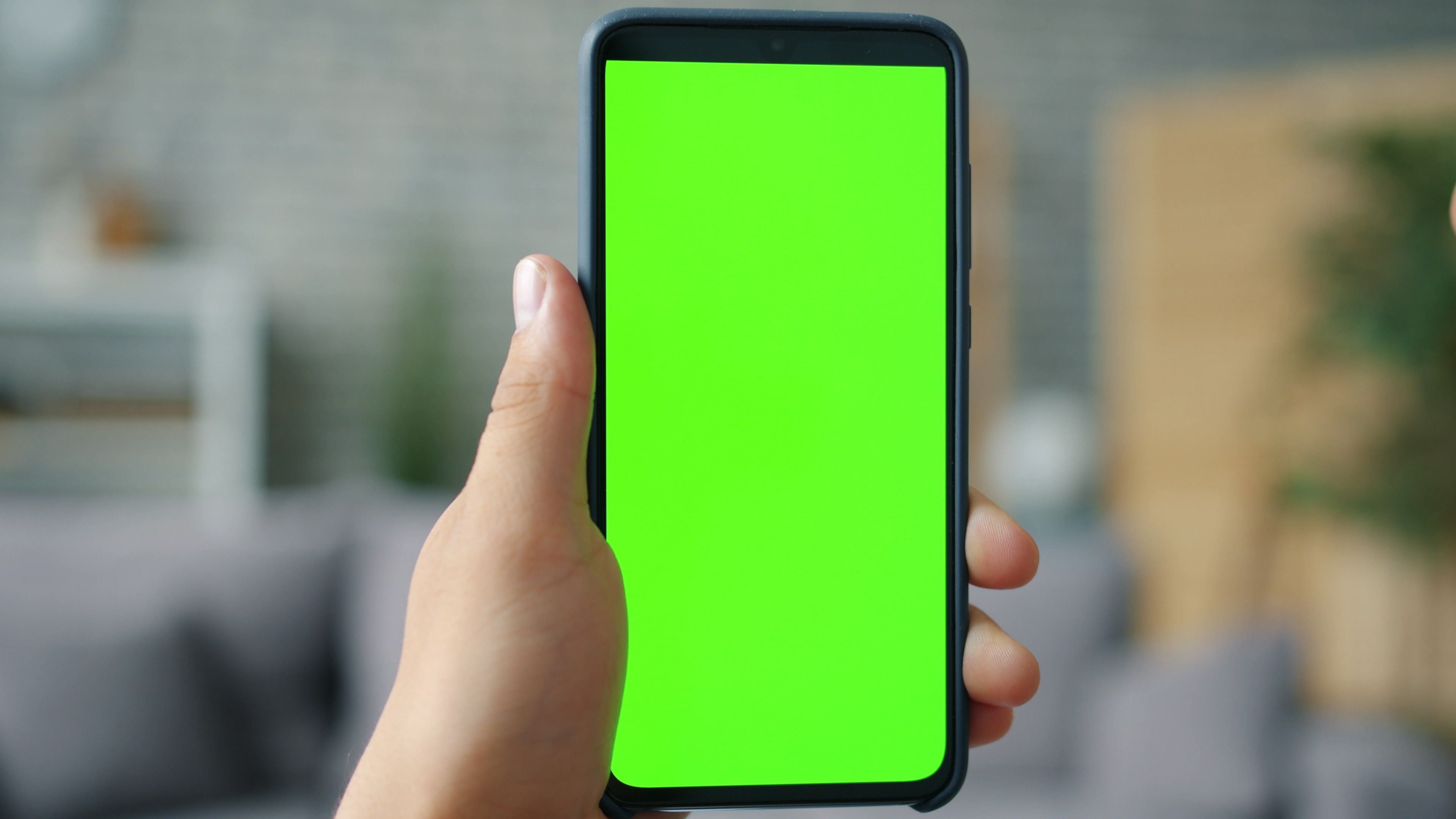 Smartphone Con Pantalla Verde En La Mano · Foto de stock gratuita