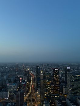 Stunning aerial view of Warsaw's skyline at twilight, highlighting the city's modern architecture.
