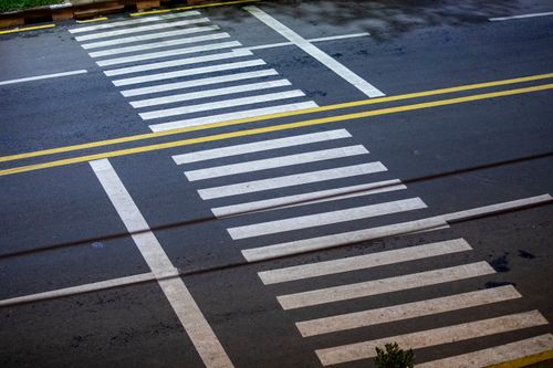 Free A well-marked crosswalk at a street intersection in Gondar, Ethiopia, captured from above. Stock Photo