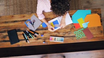 Overhead view of a paper crafting station. Photo by Vitaly Gariev on Pexels