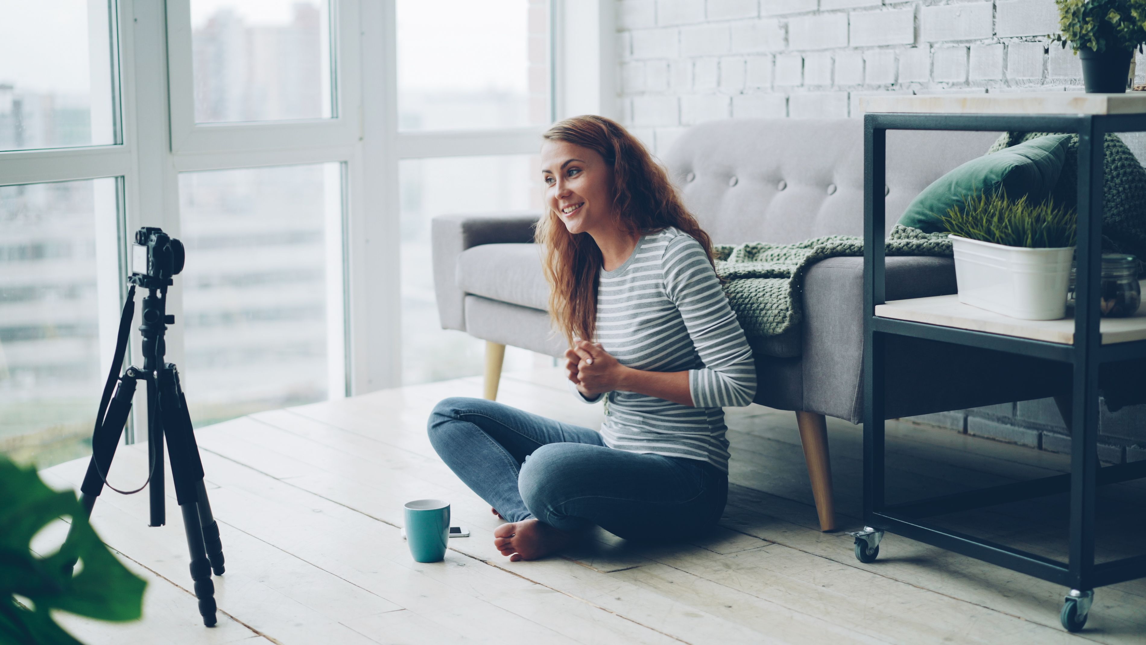 Young Woman Recording Vlog in Cozy Home Setting · Free Stock Photo