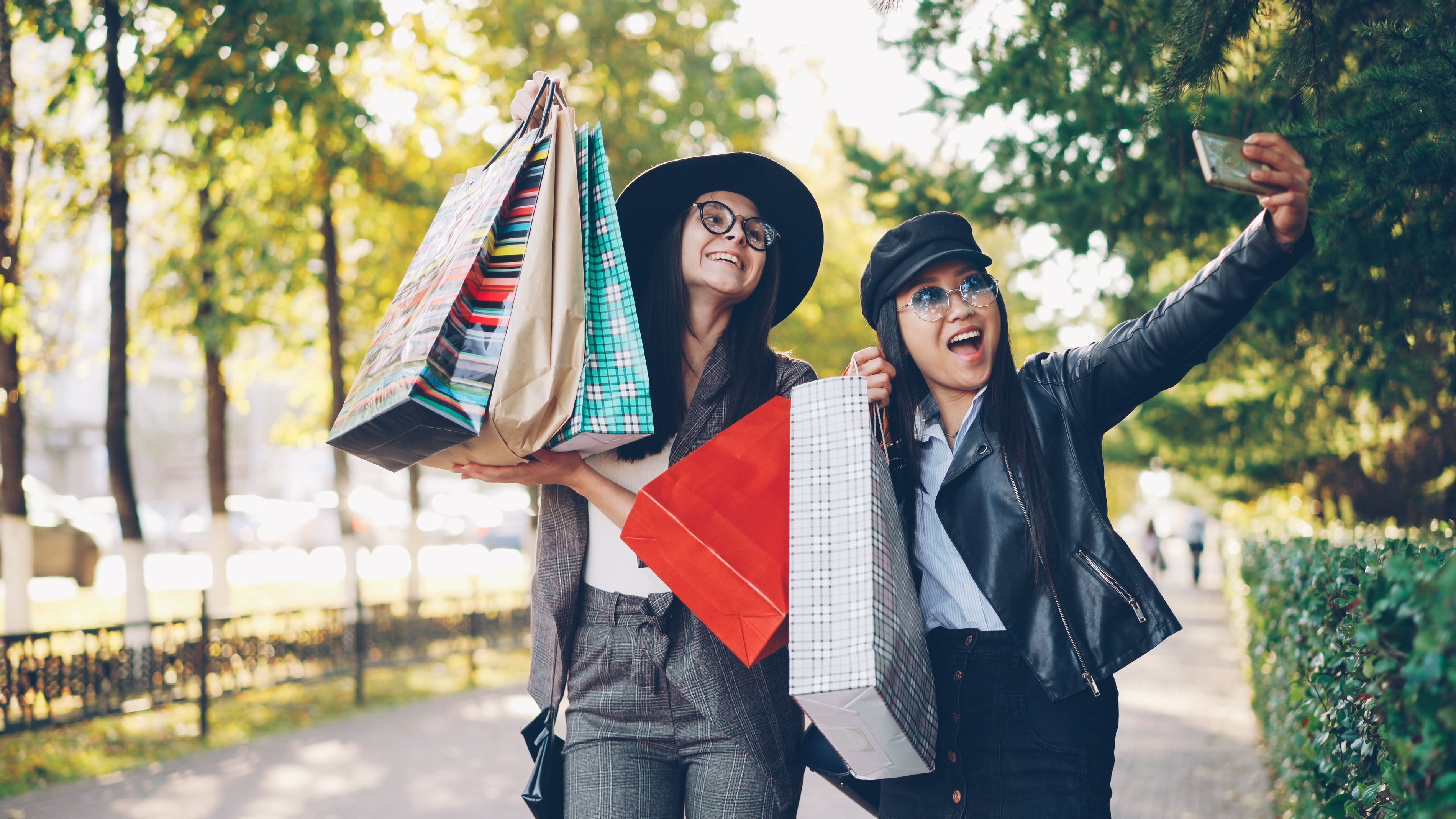 Two Women Enjoying a Shopping Spree Outdoors
