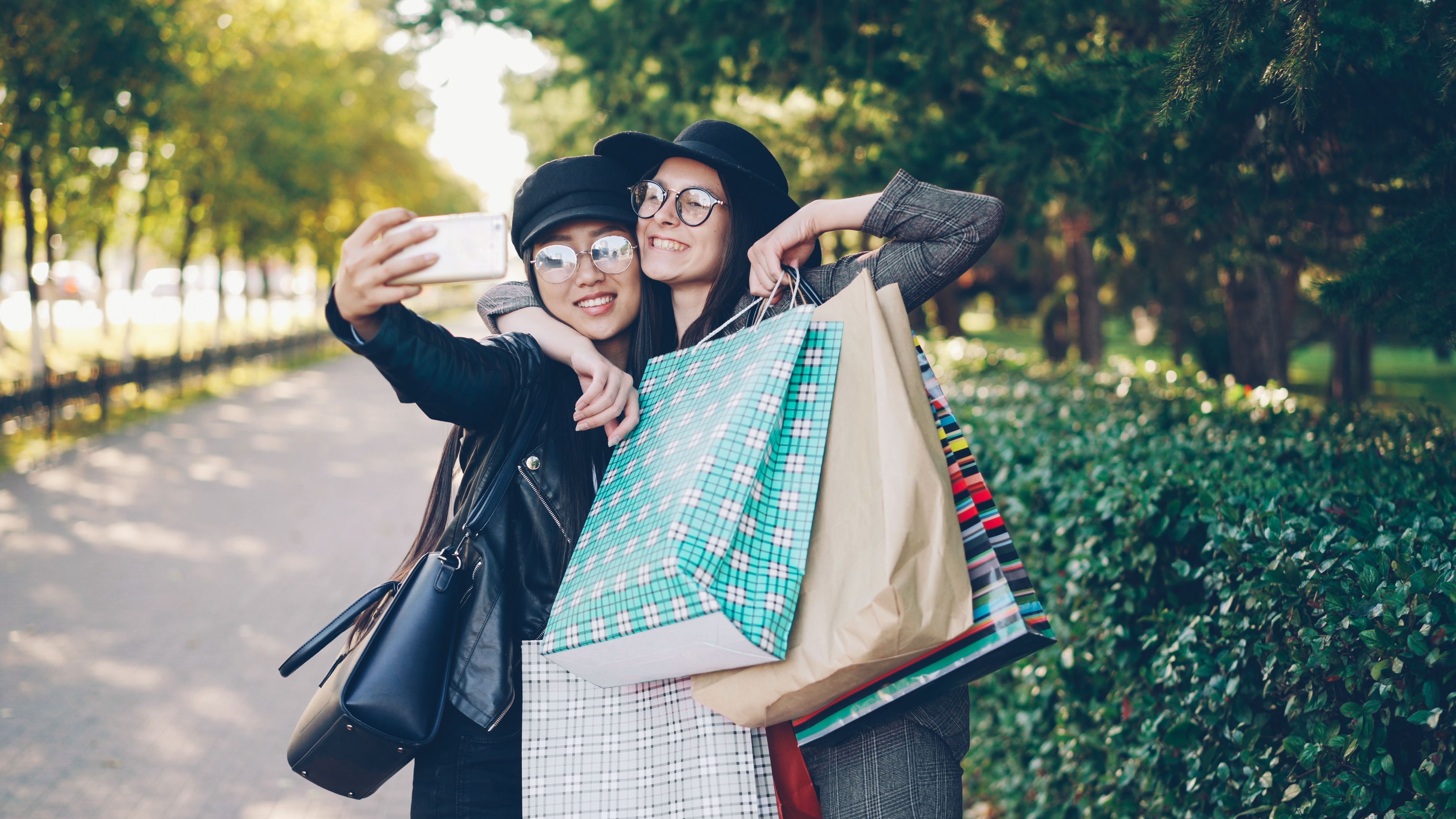 Friends Taking Selfie with Shopping Bags Outdoors