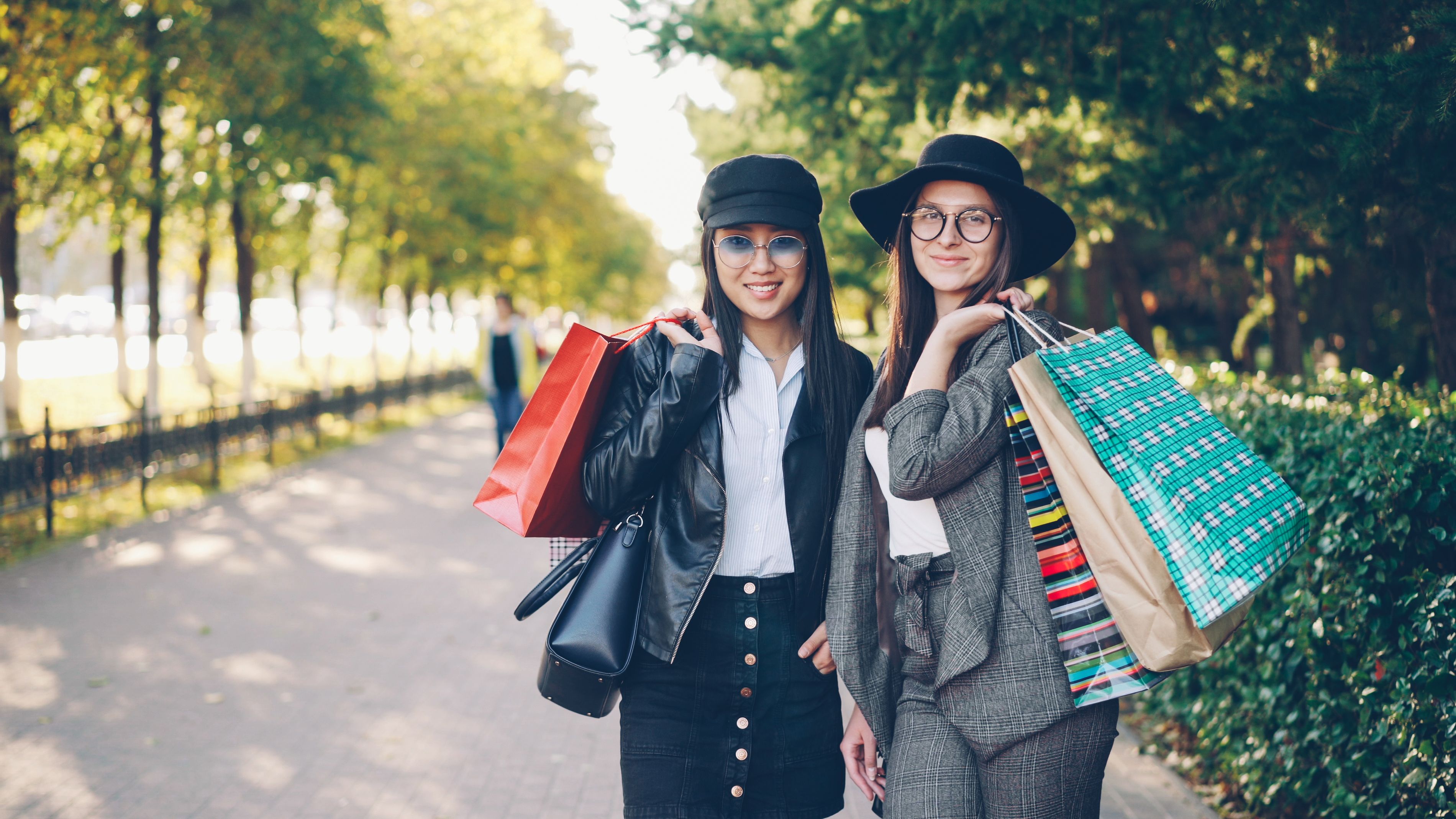 Young women shopping outdoors in autumn