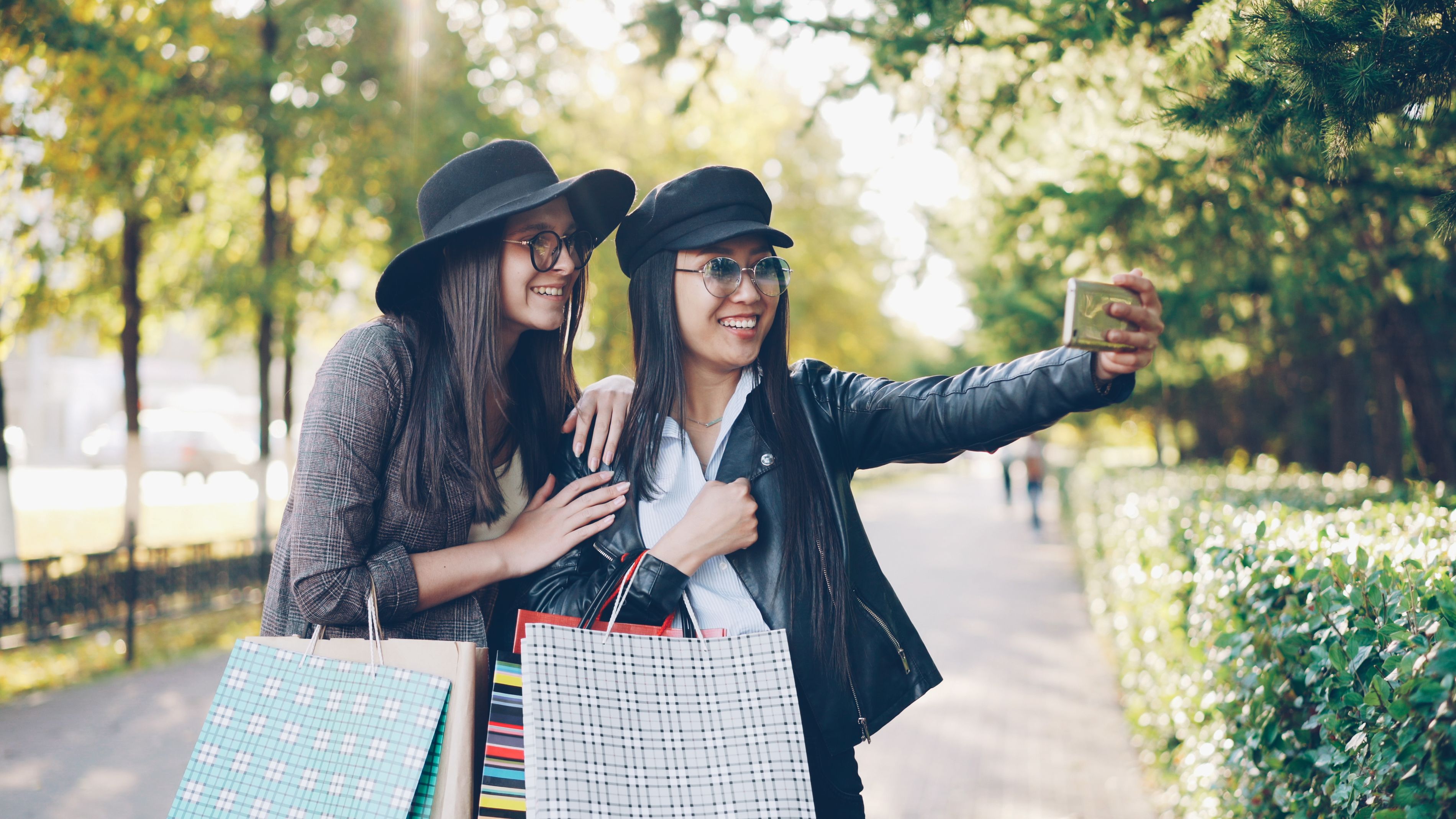 Young Women Enjoy Shopping and Taking Selfies