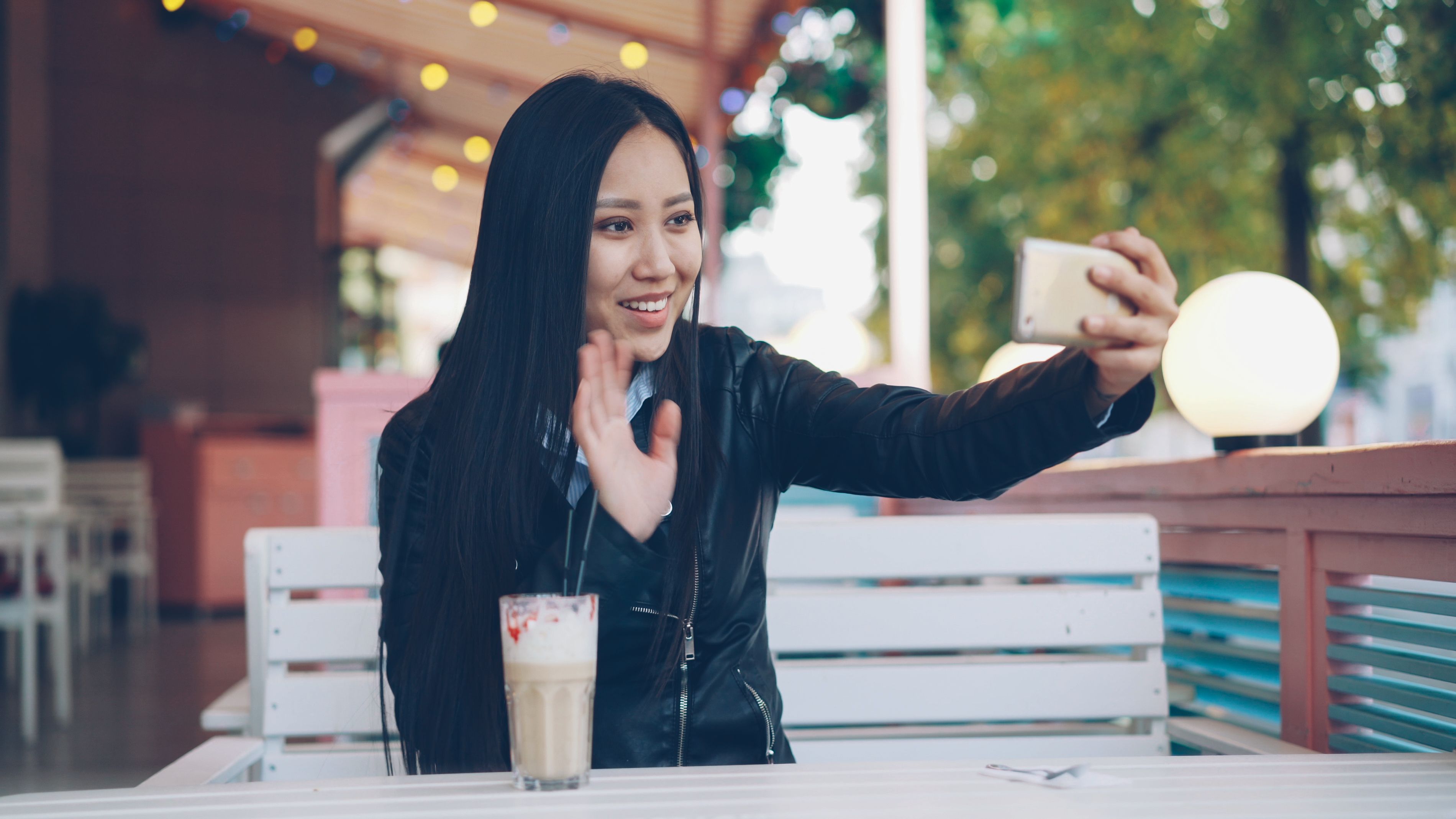 Young Woman Taking a Selfie at Café with Latte · Free Stock Photo