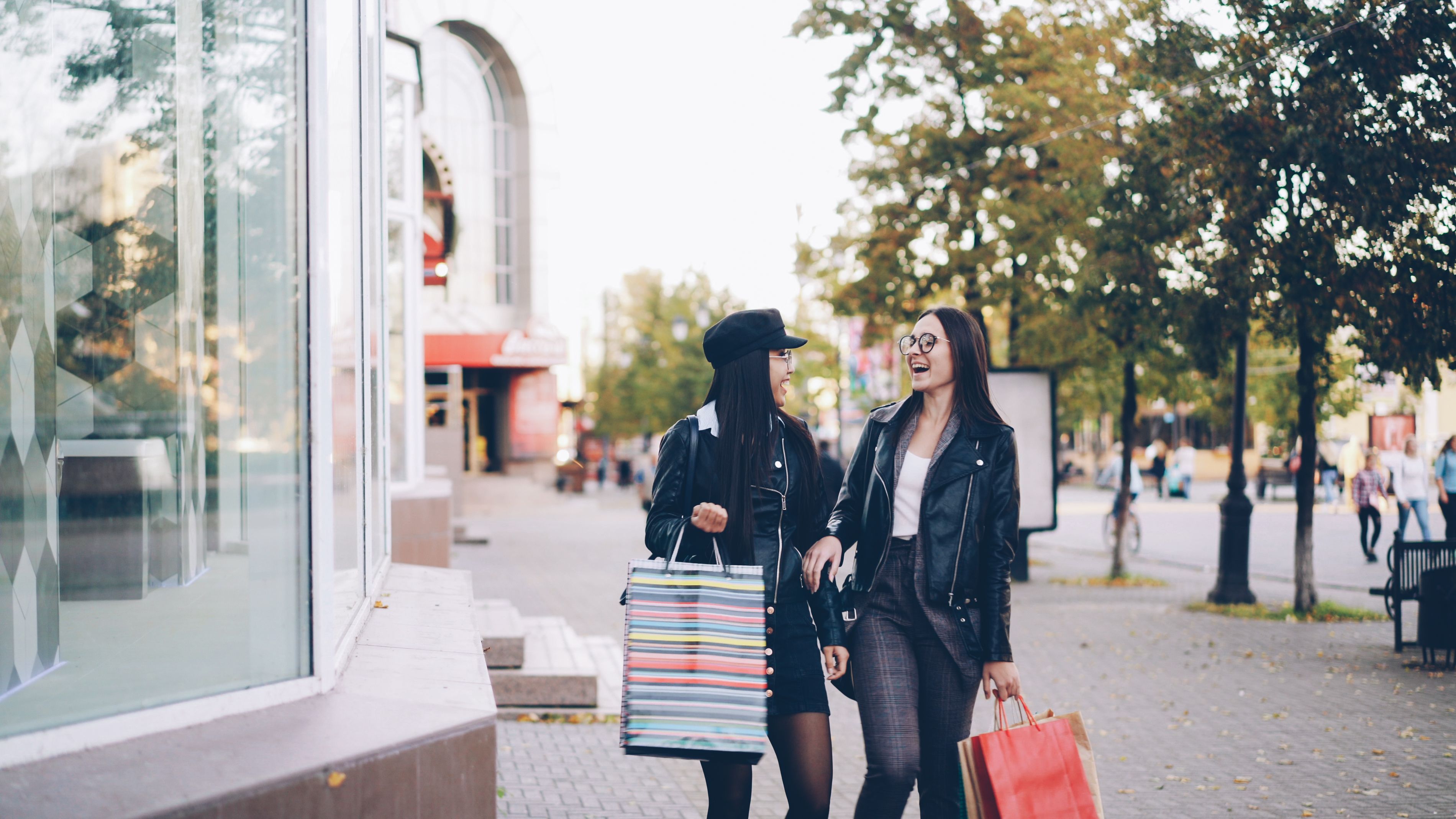 Stylish Friends Shopping in Urban Street