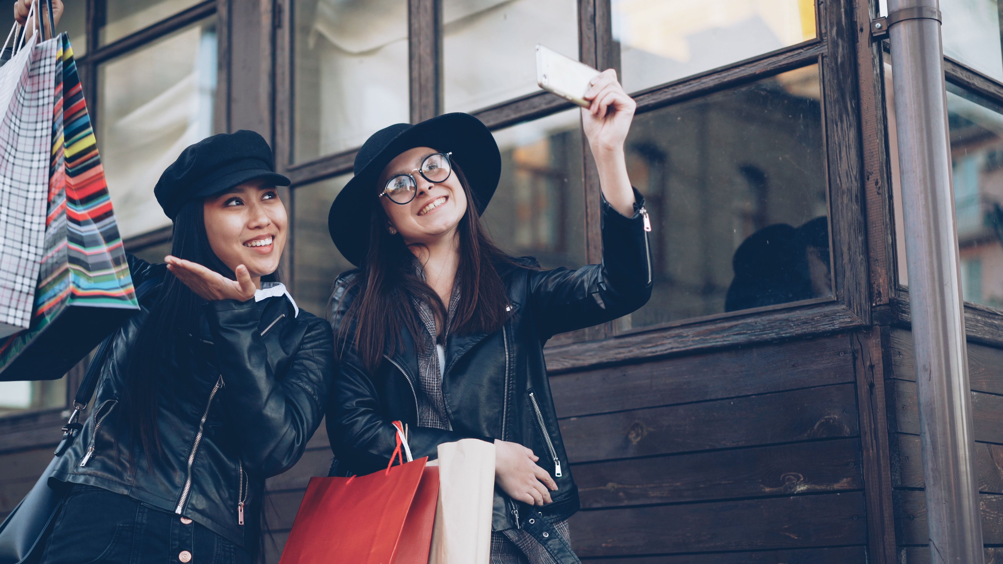 Adults take a selfie while shopping outdoors