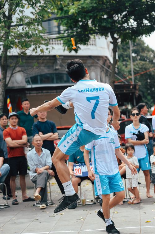 Free Dynamic street Sepak Takraw game with spectators outdoors. Stock Photo