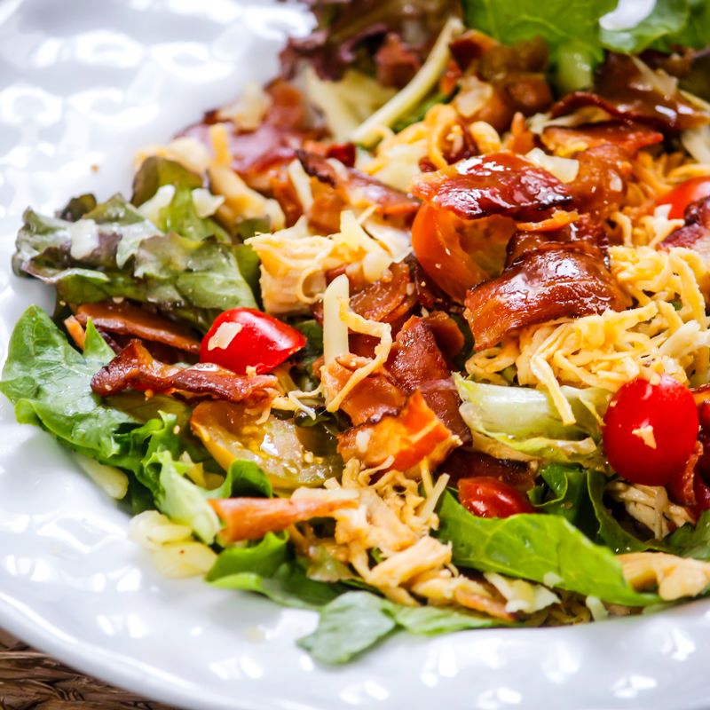 Lyonnaise Chicken Salad with Crispy Bacon and Frisée