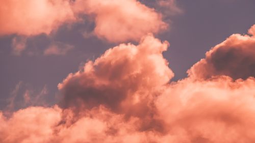 Free Stunning pink clouds captured against a soft, evening sky creating a dreamy, atmospheric scene. Stock Photo
